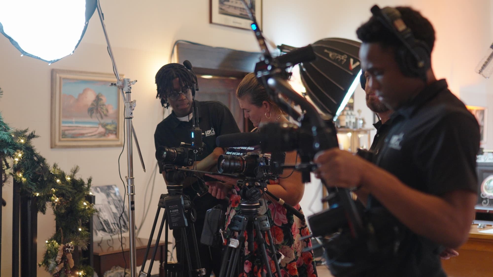 Production crew filming an on-camera interview with professional lighting