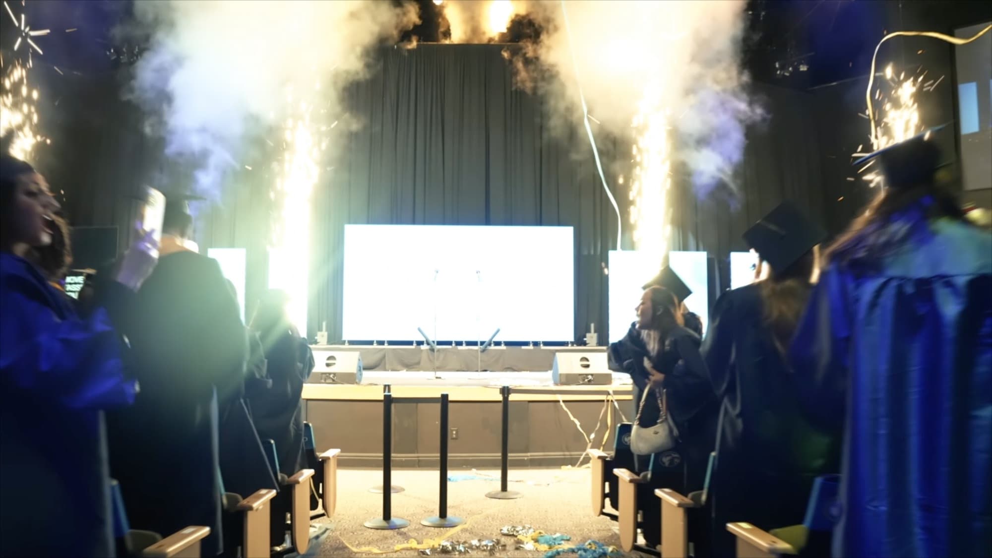 Pyro and confetti effects firing at the IRSC commencement stage